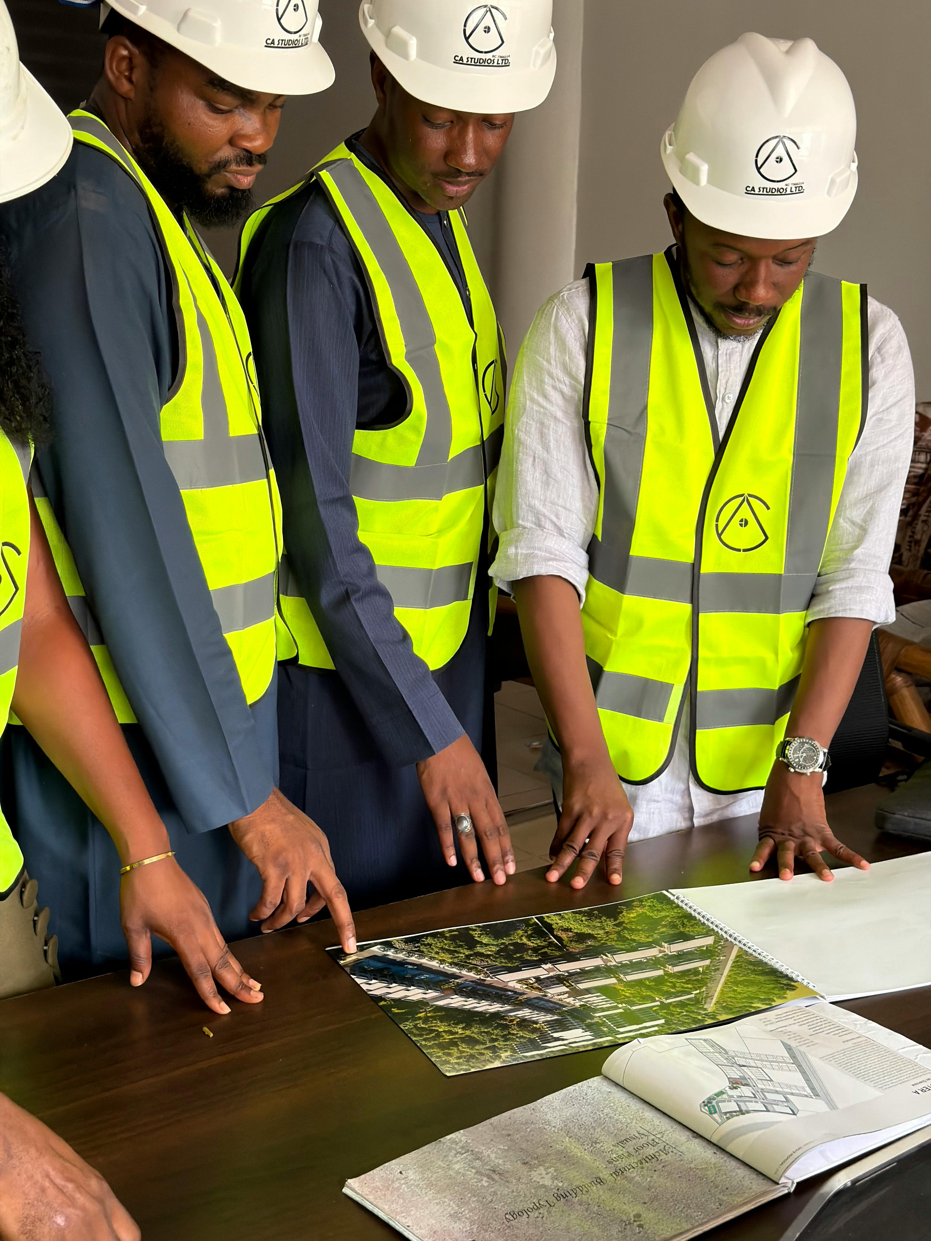 Engineering team reviewing construction plans during a workload planning meeting